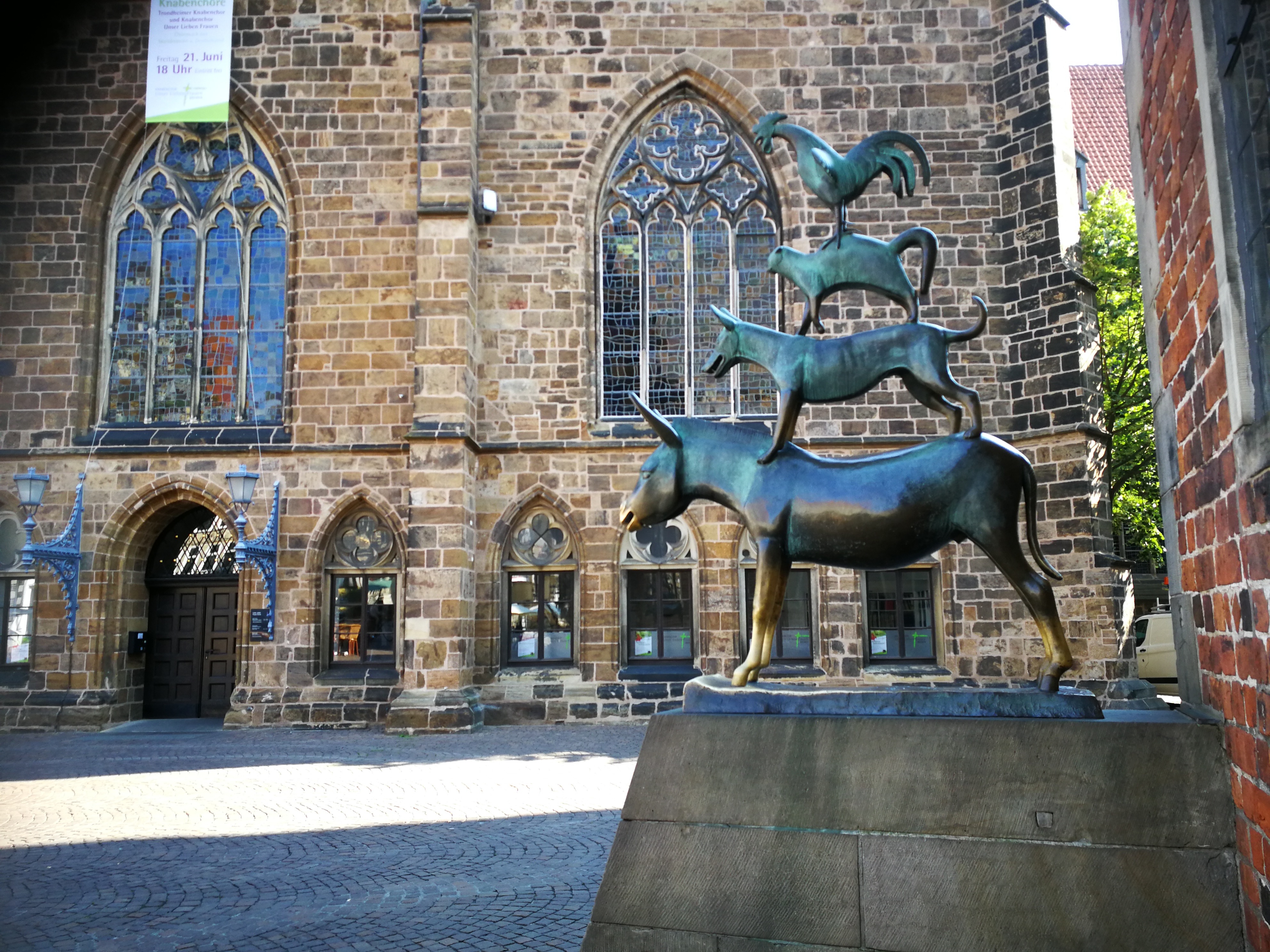 Animal statue in front of historic building.