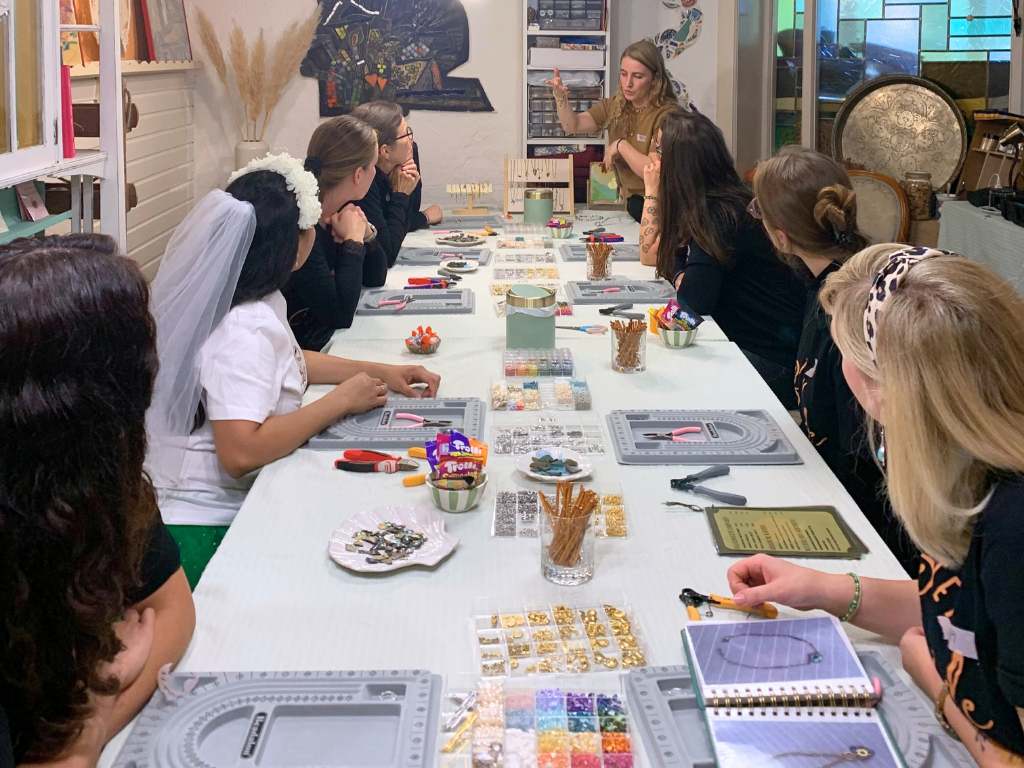 Group making crafts at a long table.