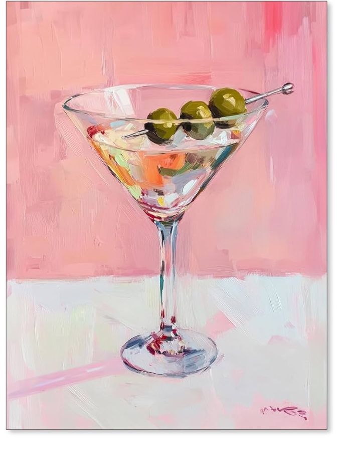 Martini glass with olives, pink background.