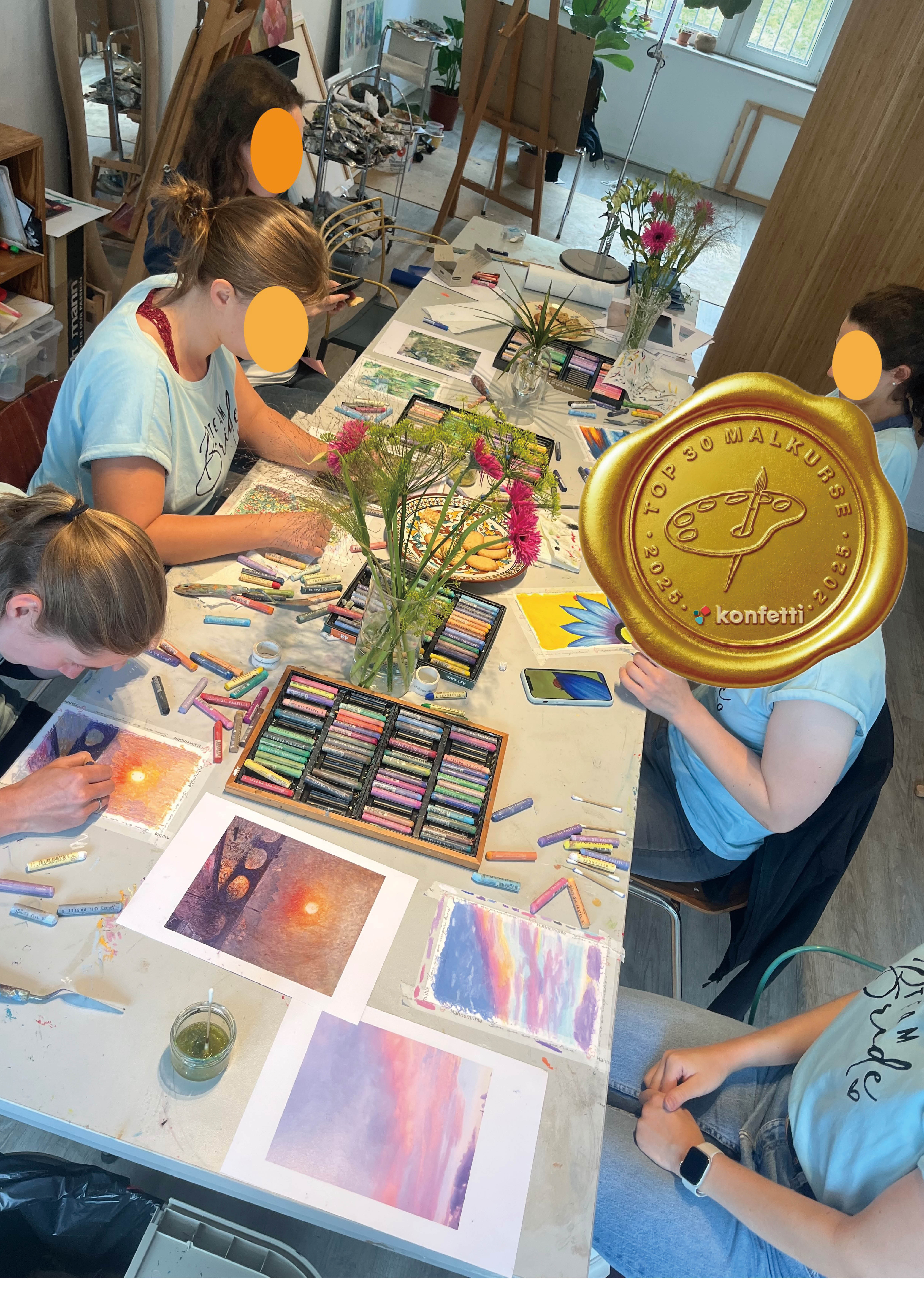 People painting with pastels in an art studio.