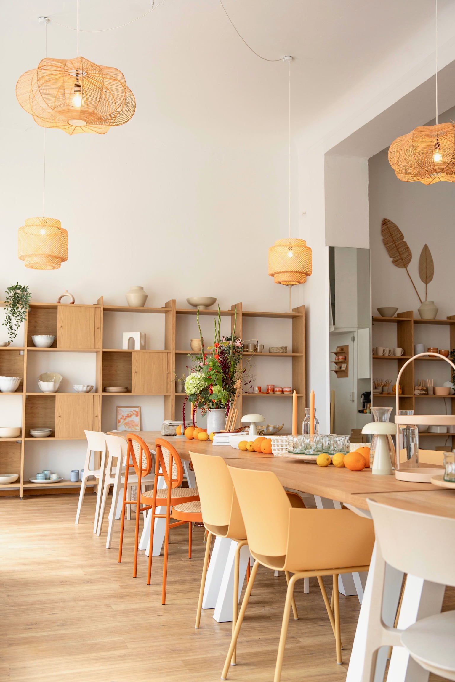 Dining area with wooden shelves and table.