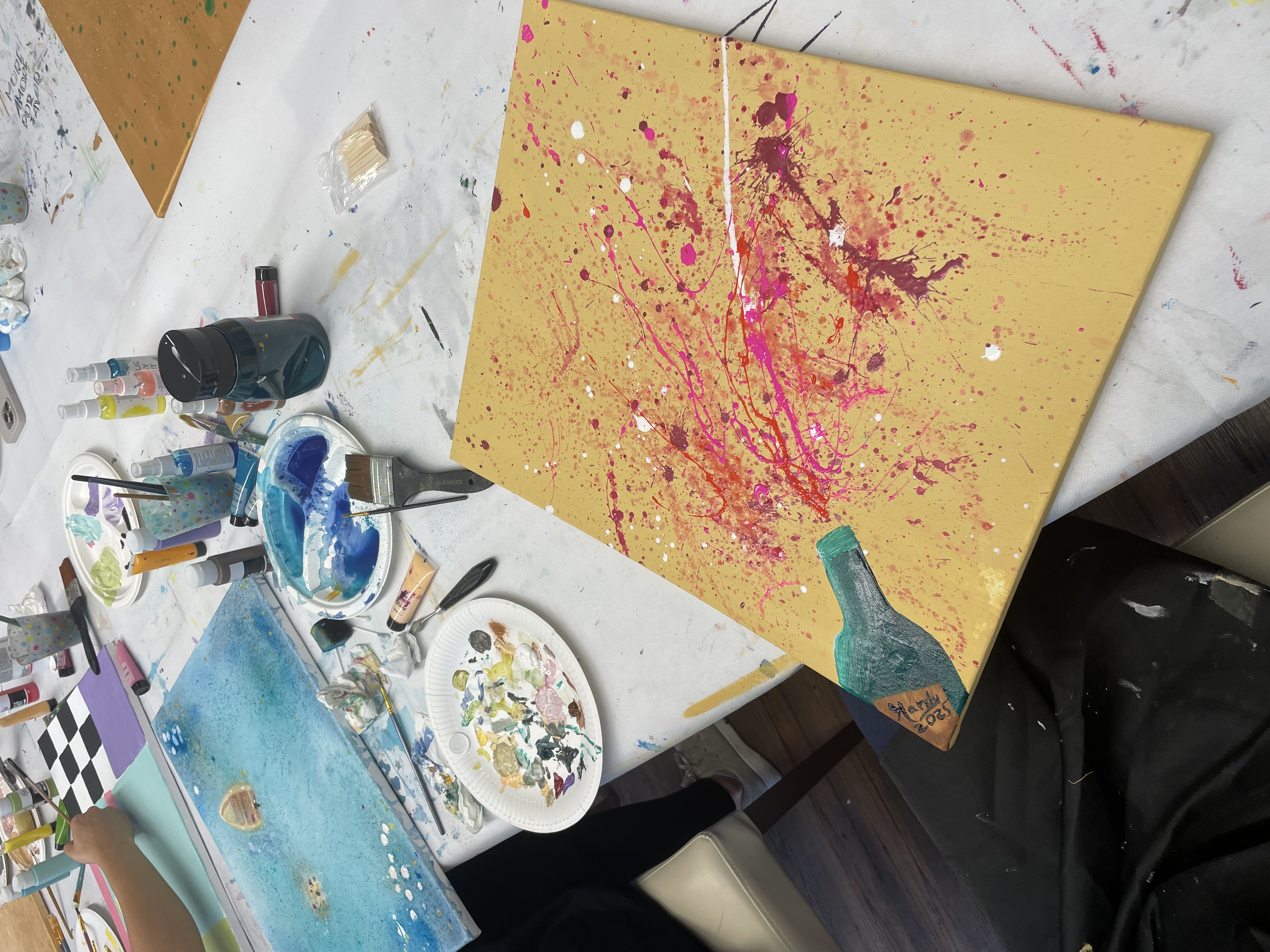 Colorful abstract painting on canvas, splatter style.