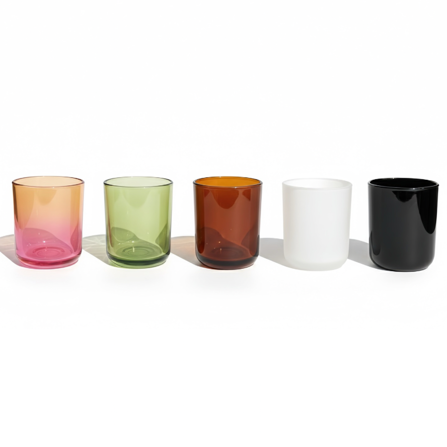 Colorful glass cups lined up on a white background.