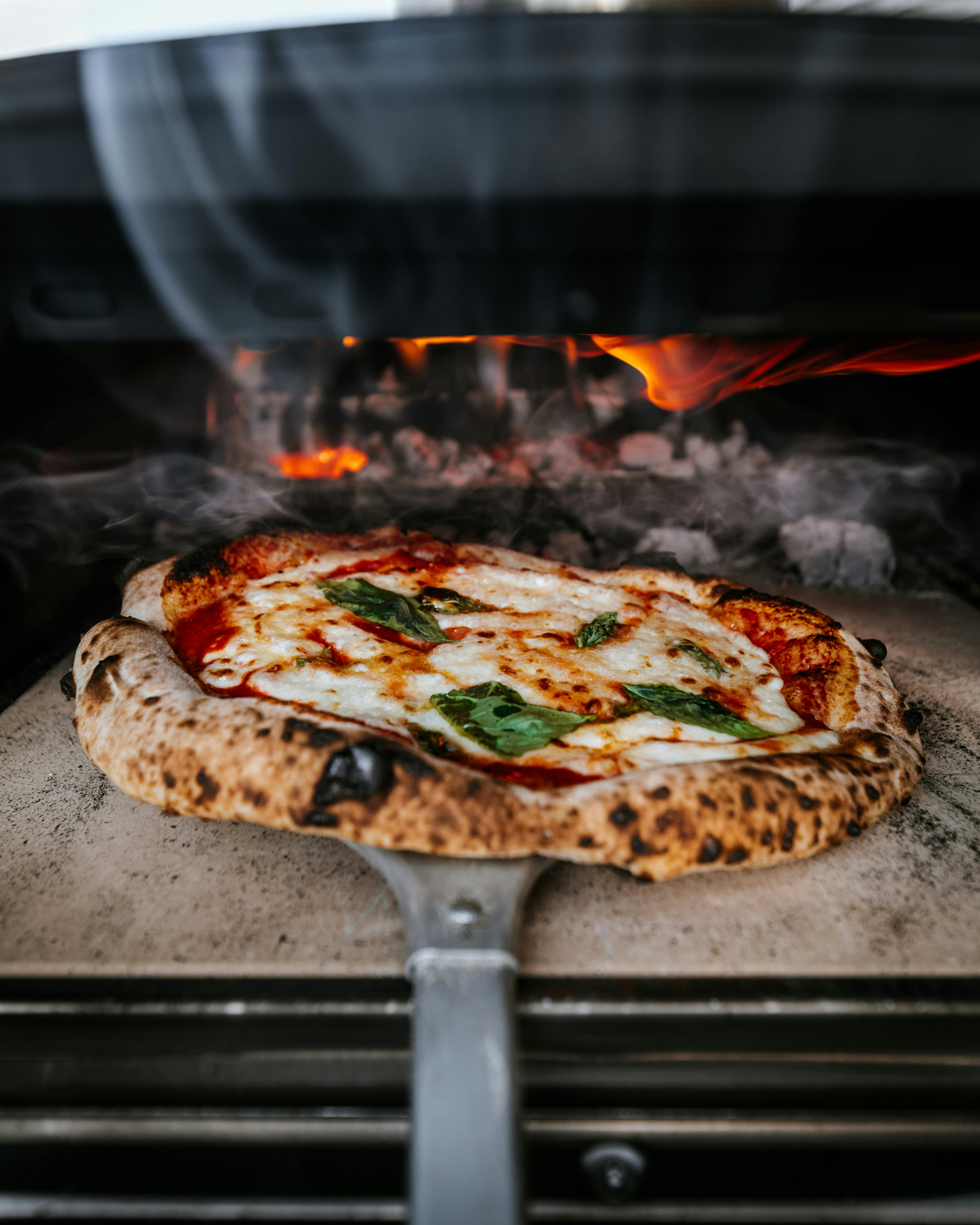 Pizza baking in a wood-fired oven.
