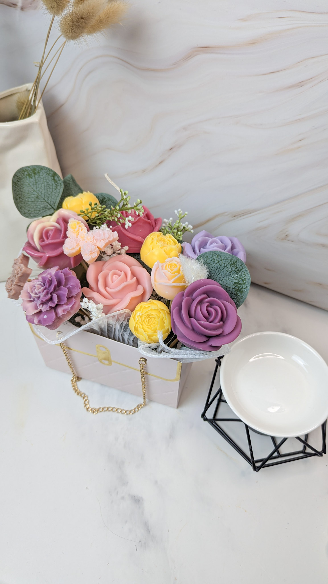 Colorful soap flowers in a decorative box.