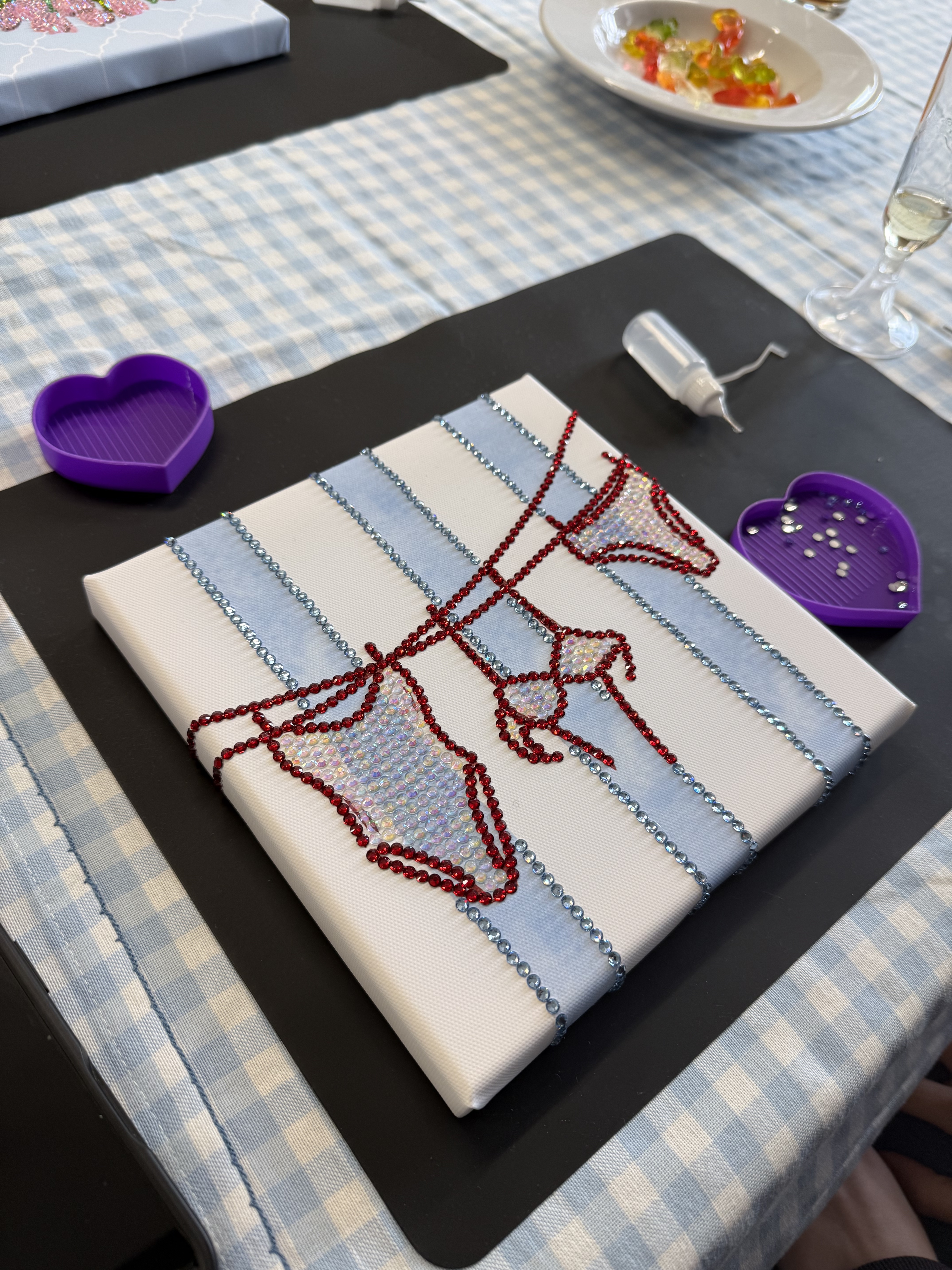 Rhinestone bikini design on striped canvas.