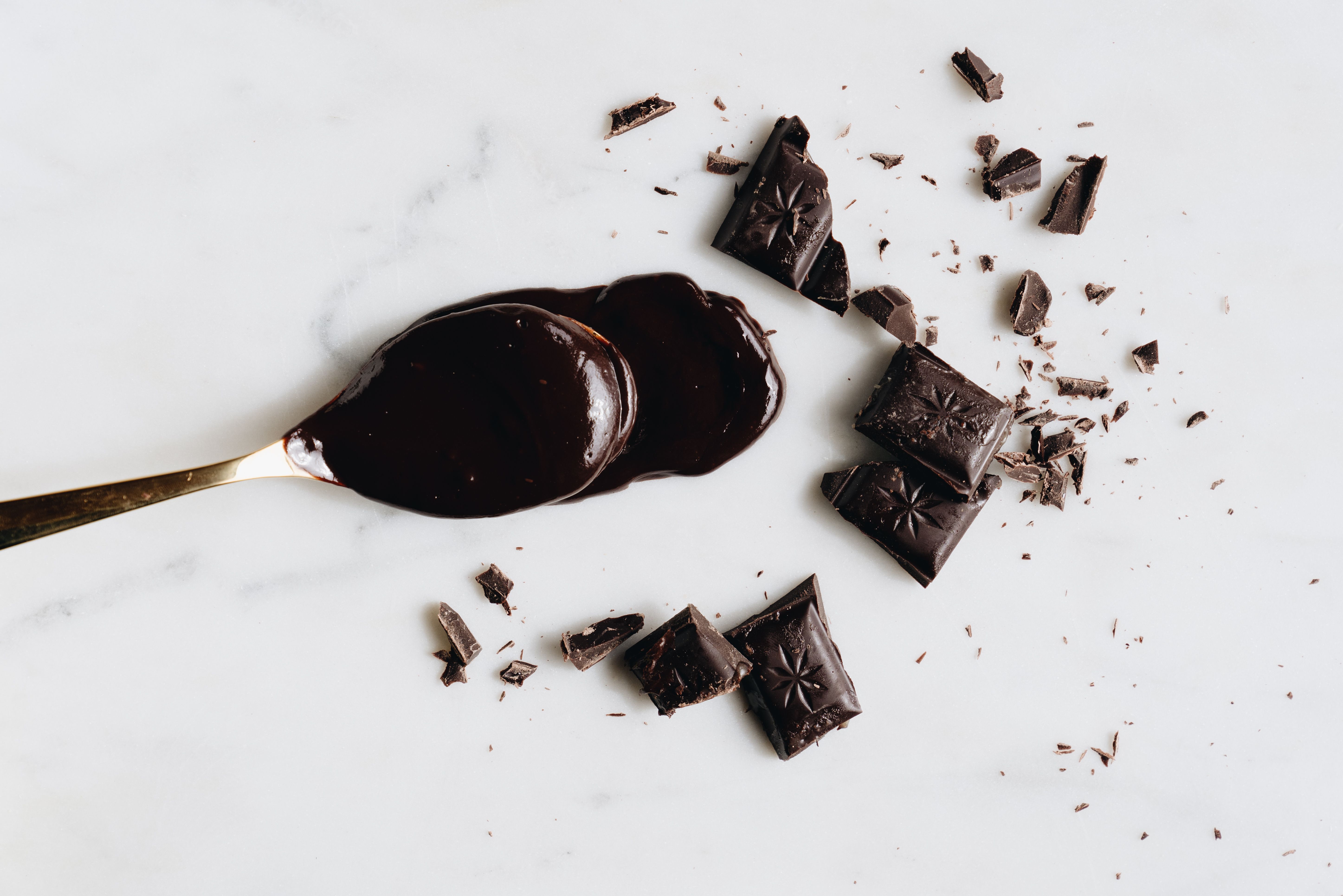 Chocolate spoon with dark chocolate pieces.