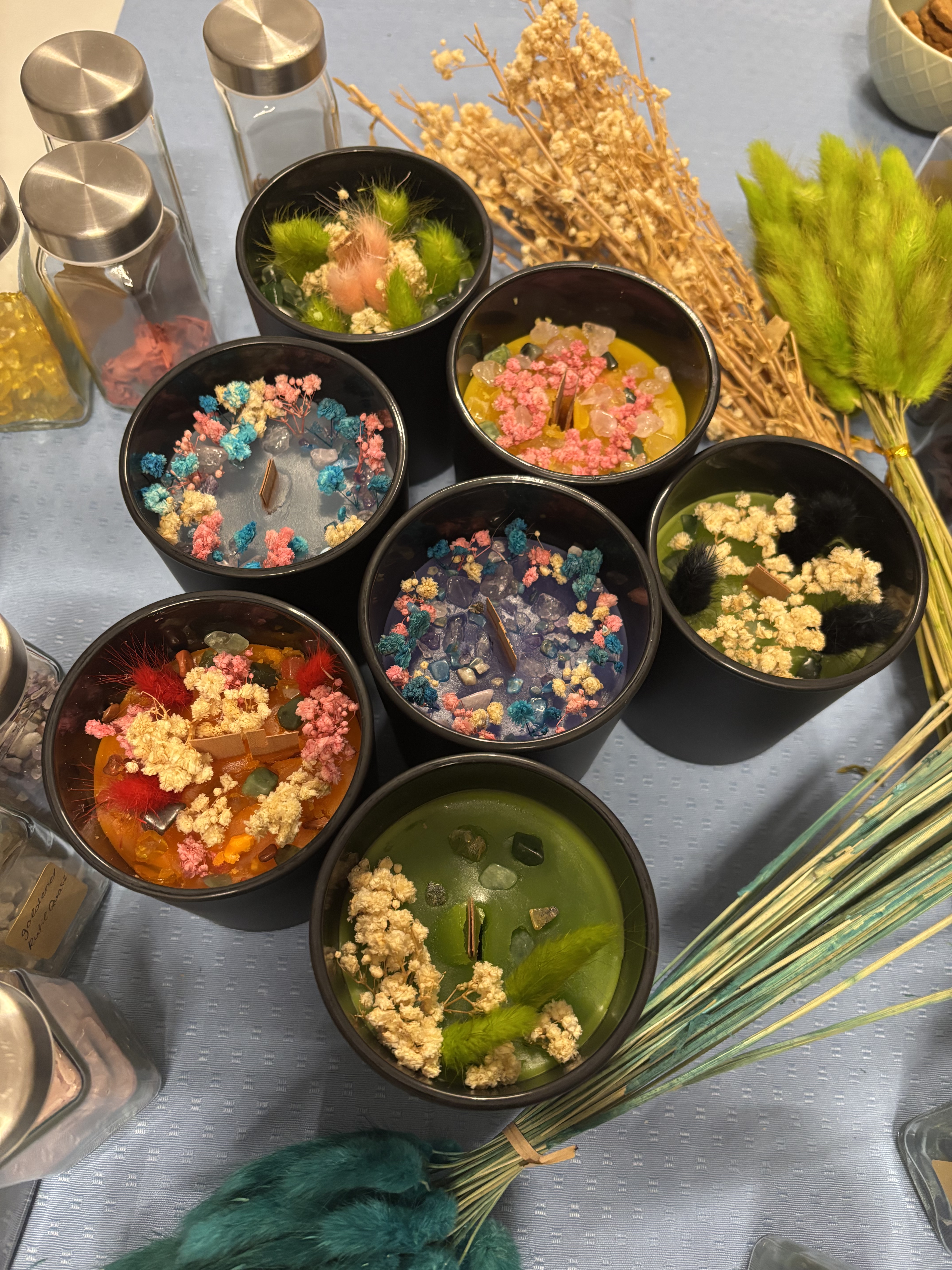 Colorful decorative candles on display table.