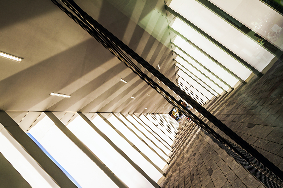 Long, bright corridors with shadows and reflective surfaces.