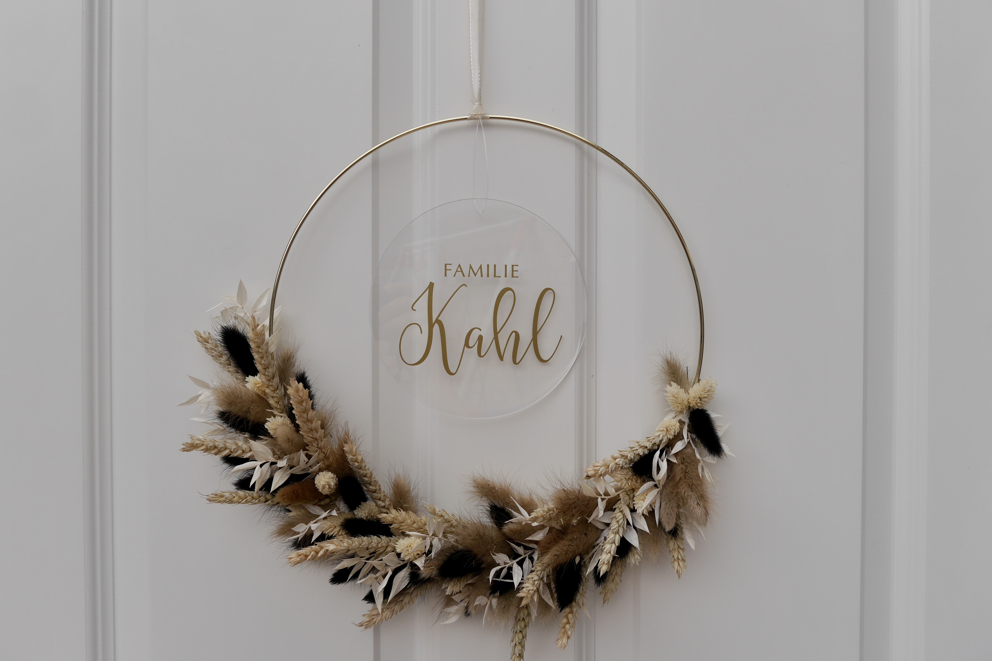 A decorative wreath hangs to greet a family