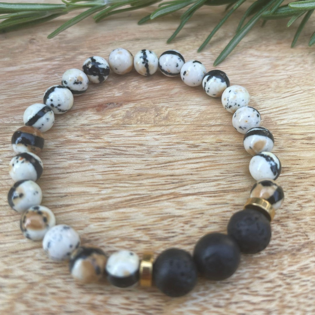 Colourful pearl bracelet sits on a wooden surface