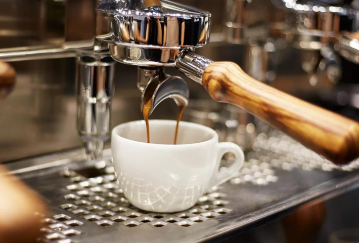 Coffee mug is filled with freshly brewed espresso