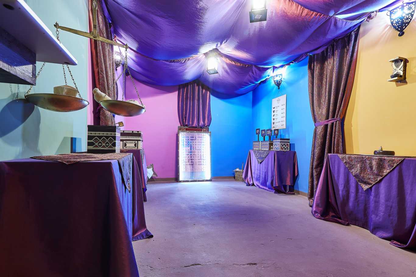 Colourful walls, floating ceiling, tables are decorated.