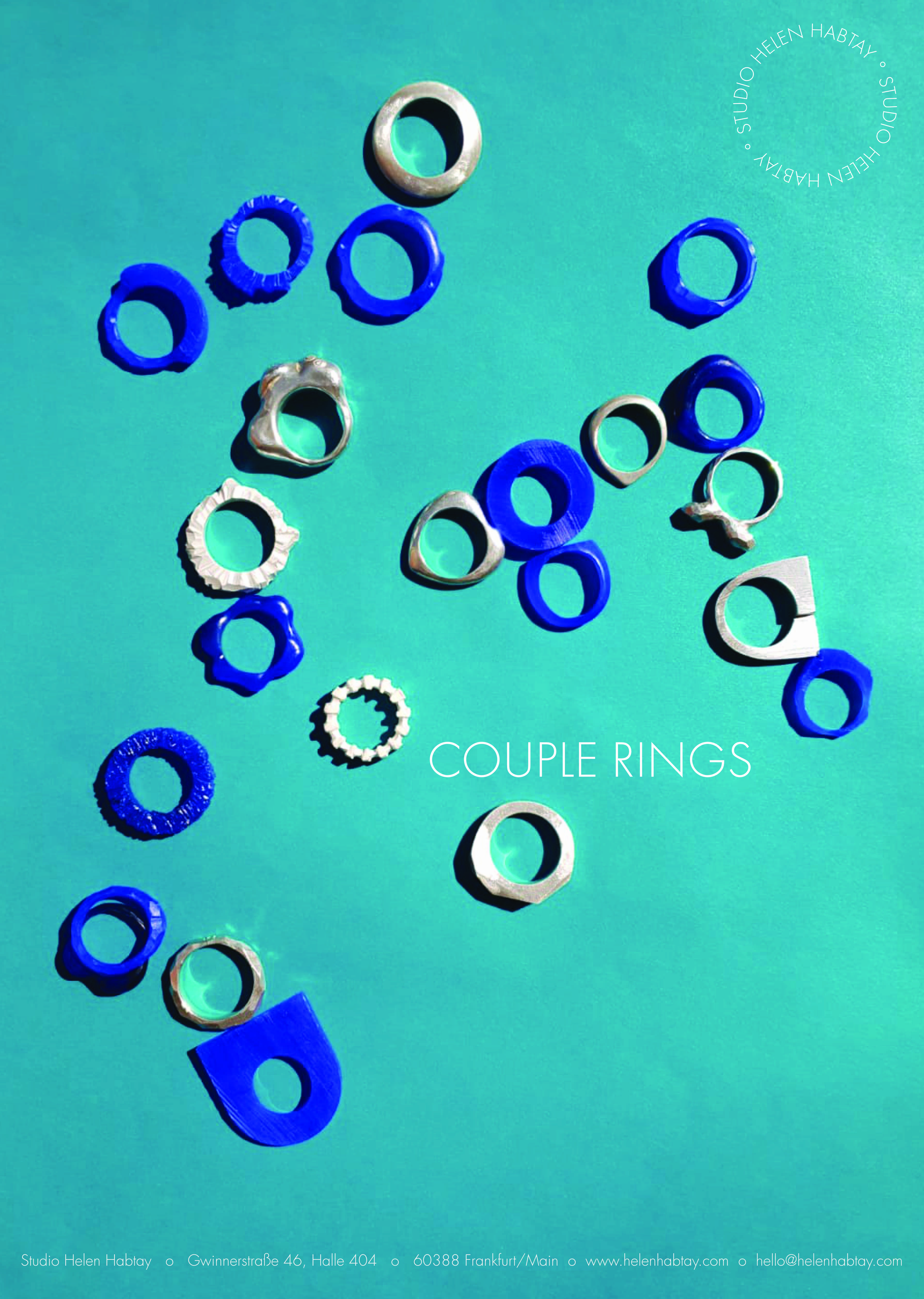 Pairs of rings are scattered on a blue surface.