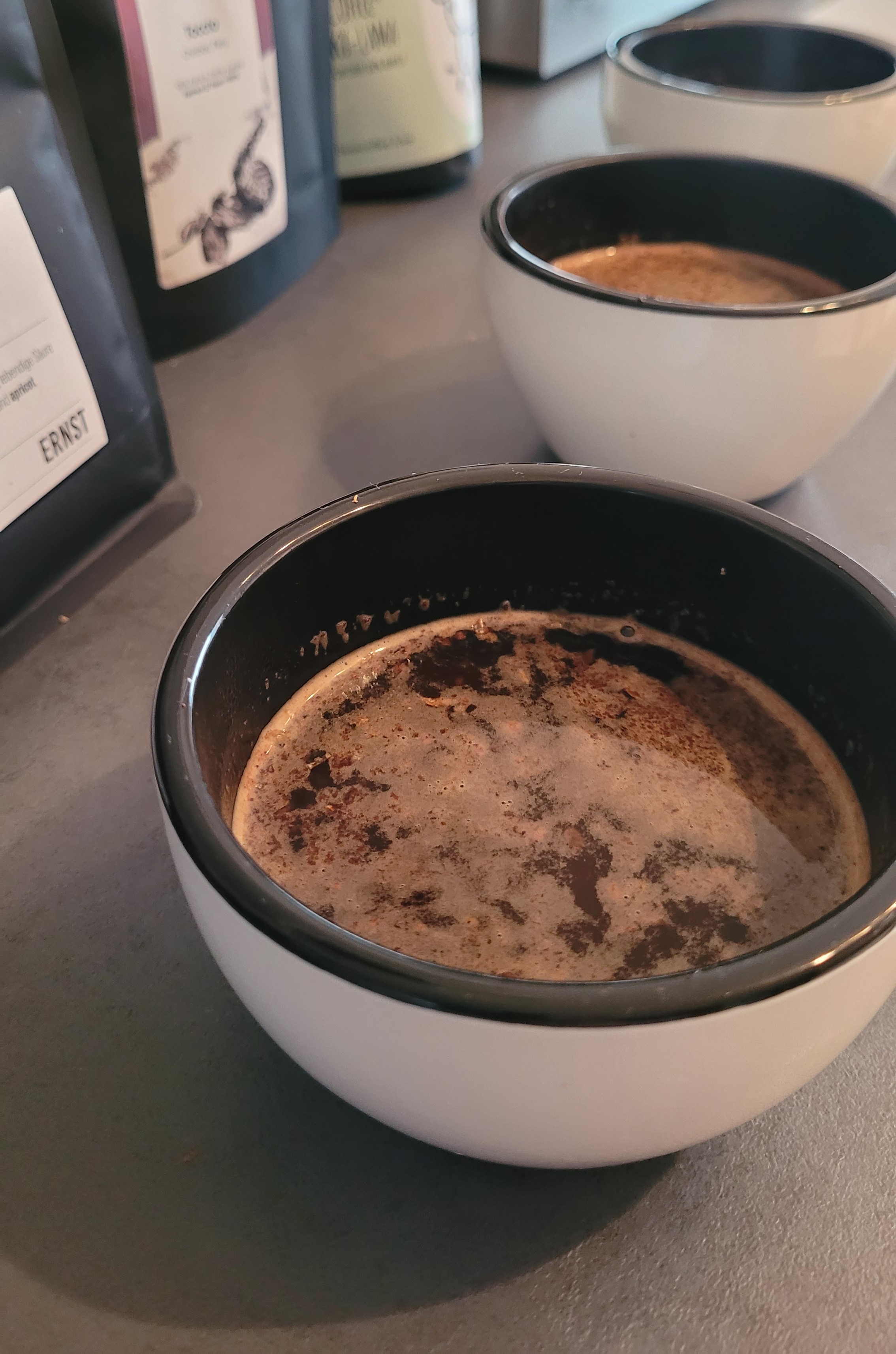 Three cups of coffee on a table.