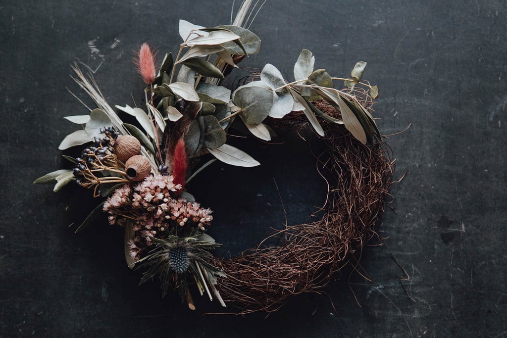 Dried flower wreaths decorated on a scarf background.