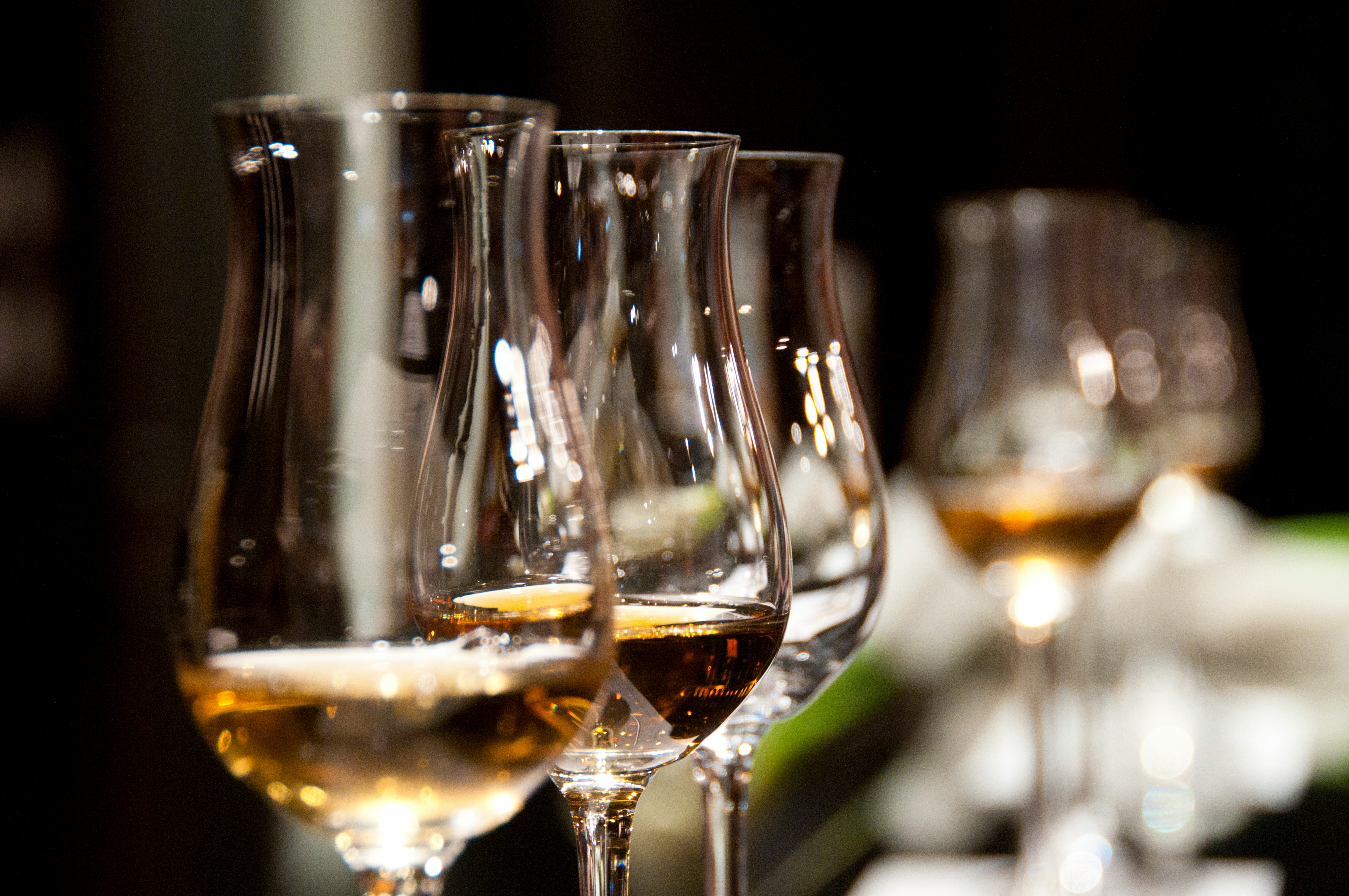 Close-up of whiskey glasses on a table.