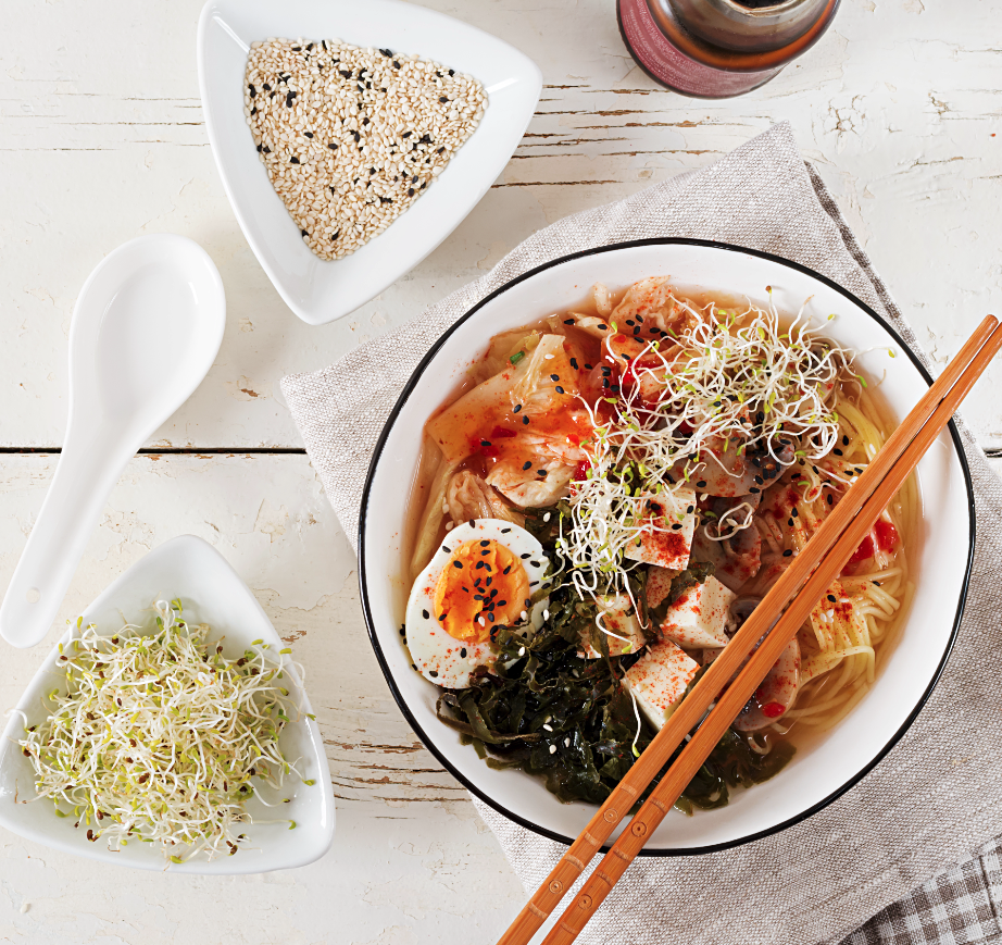 Bowl of ramen with vegetables and egg.