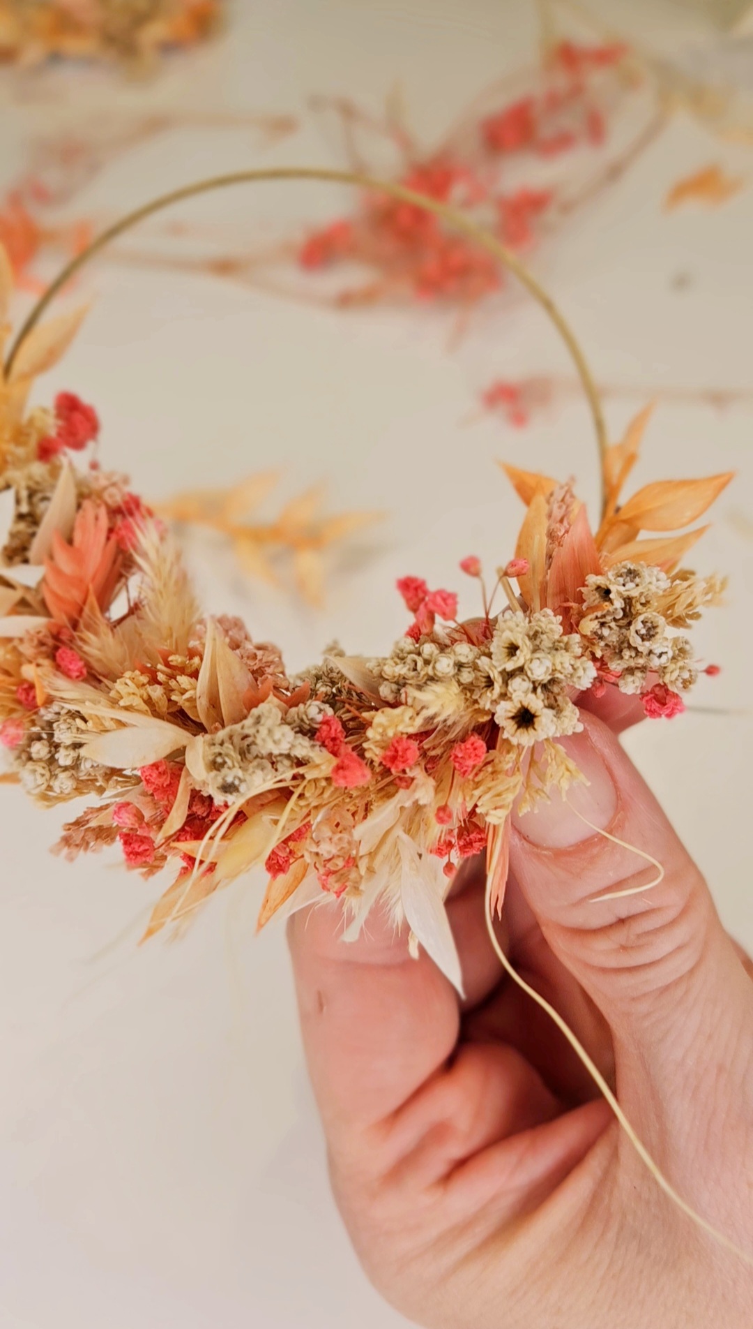 Dried flower arrangement held in hand.