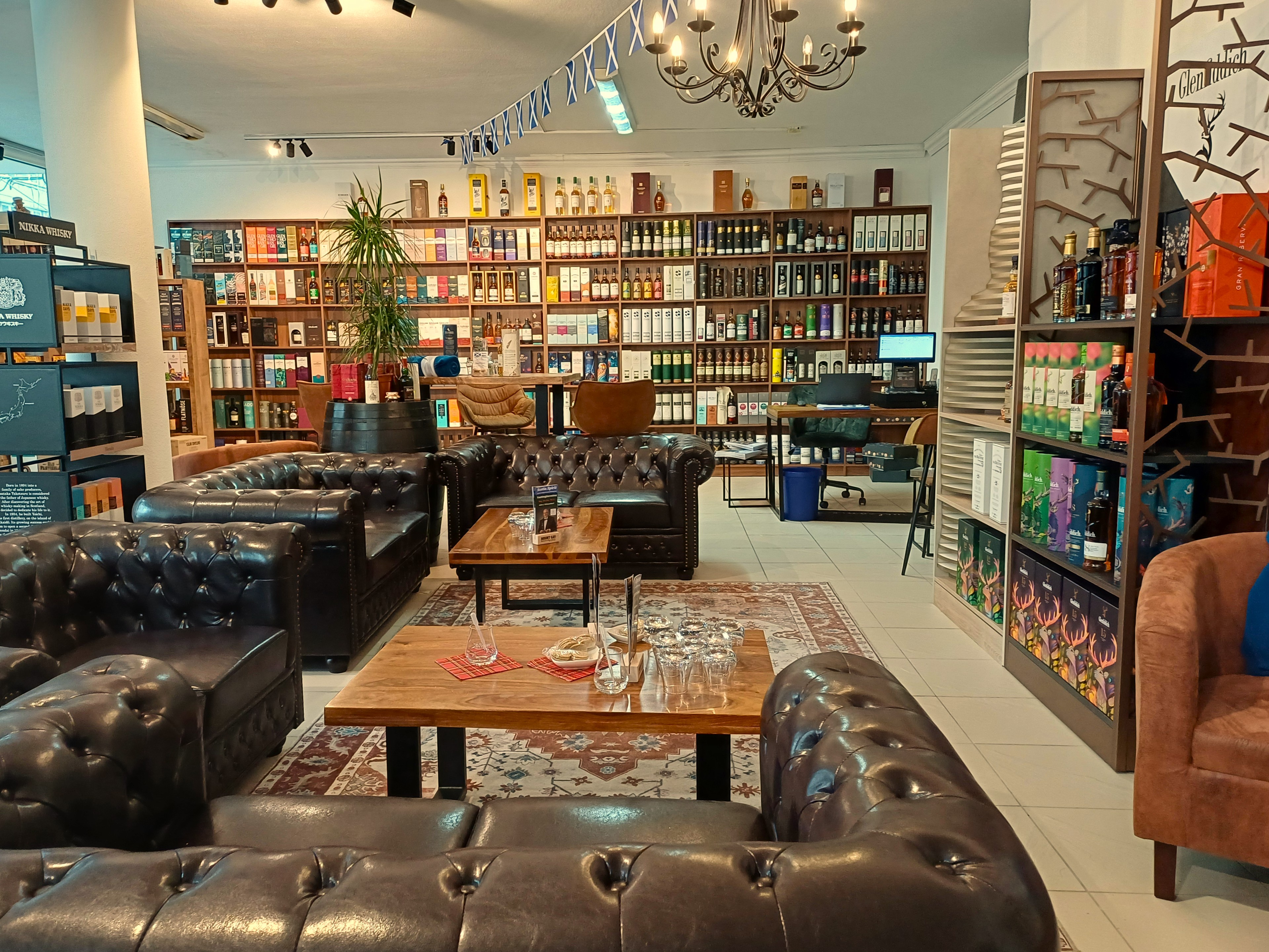 Leather couches in a whisky shop lounge.