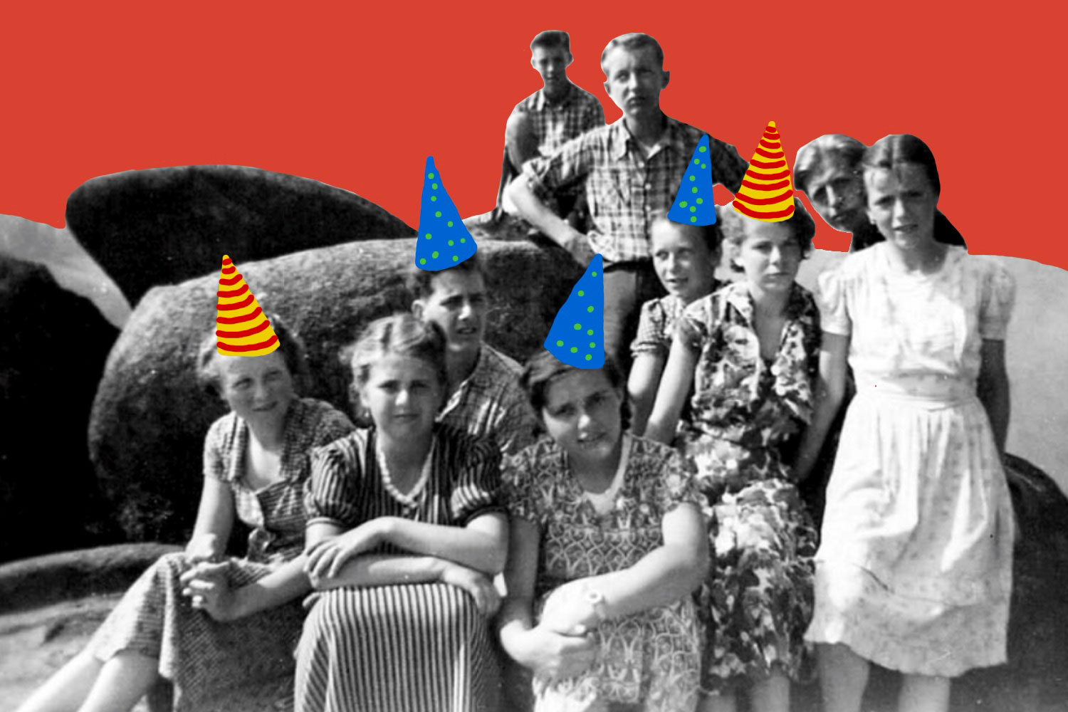 Group wearing party hats on rocky landscape.