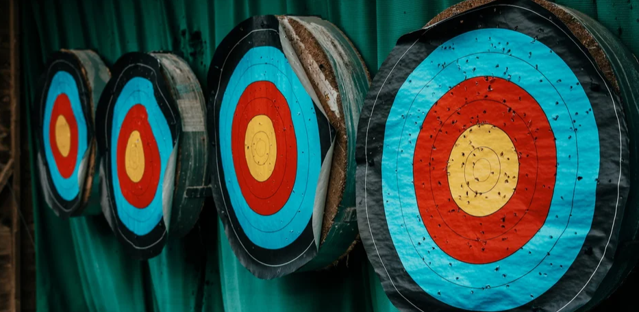 Four colorful archery targets in a row.