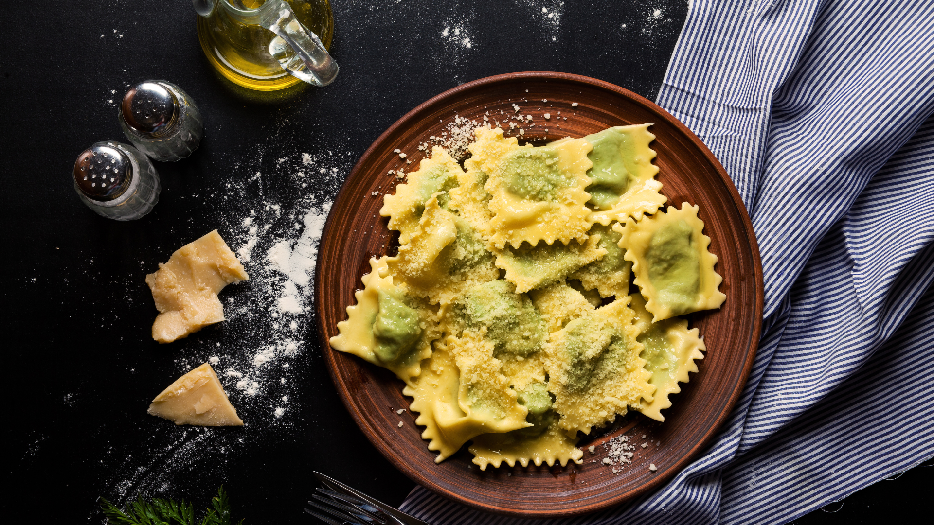 Ravioli on plate with cheese and oil.