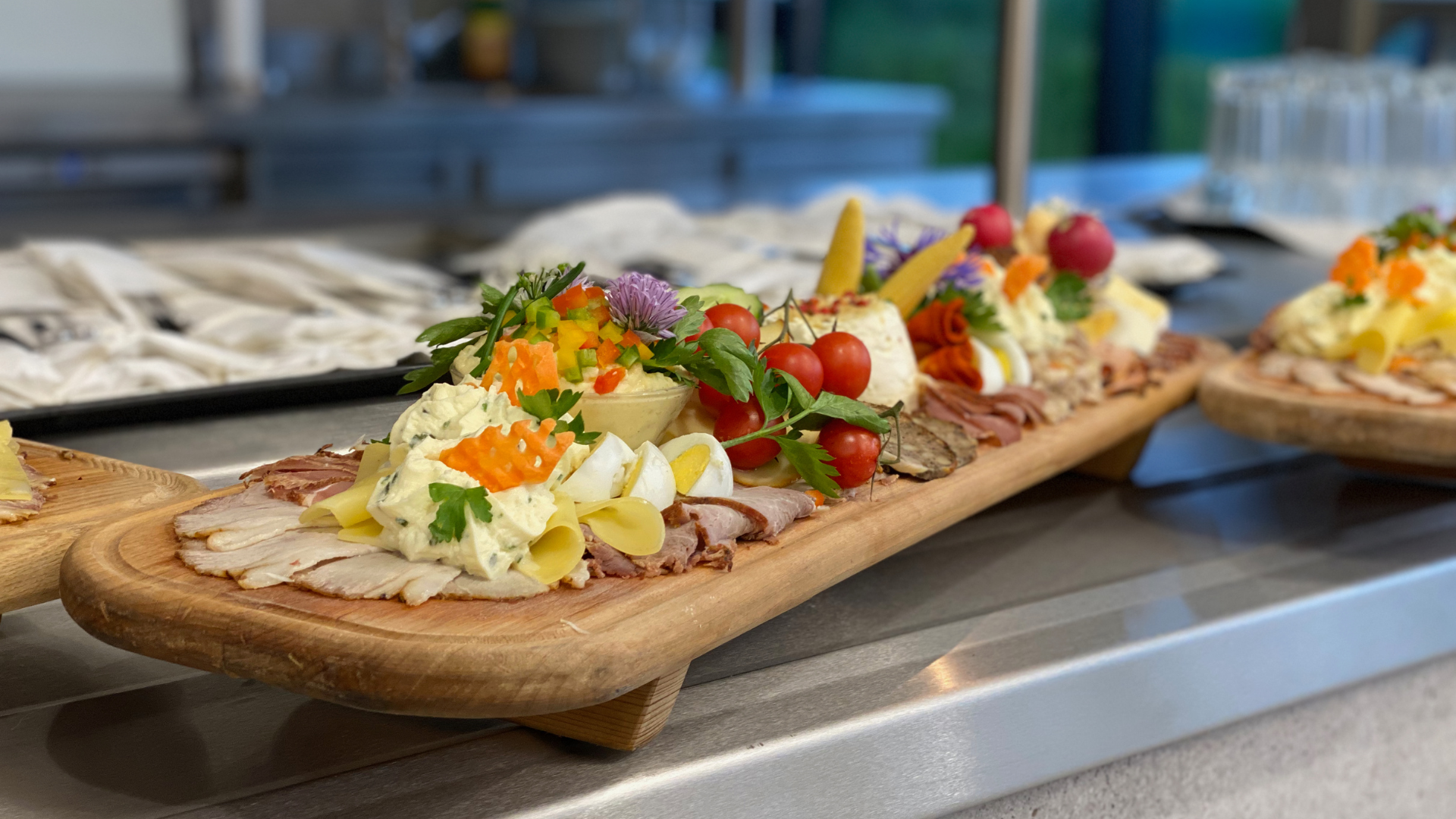 Colorful platter with meats and vegetables on counter.