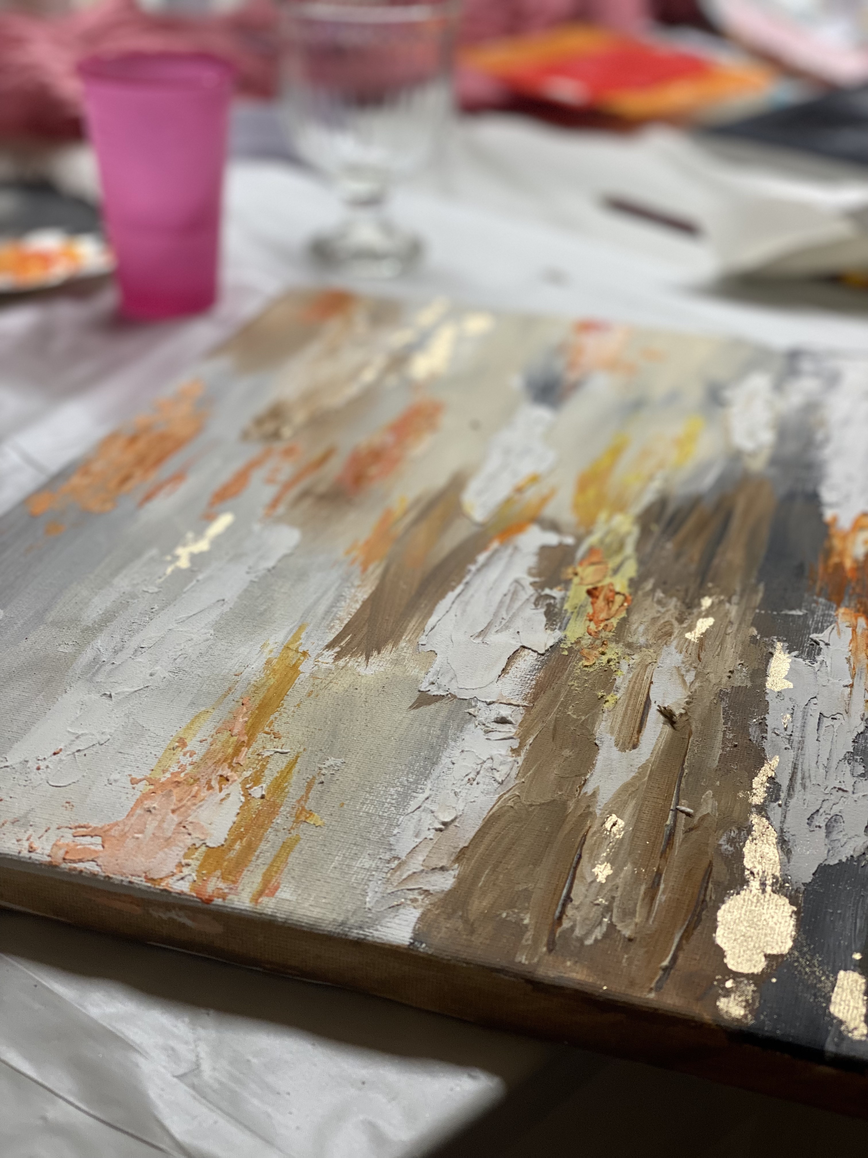 Abstract textured painting, earthy tones, close-up view.