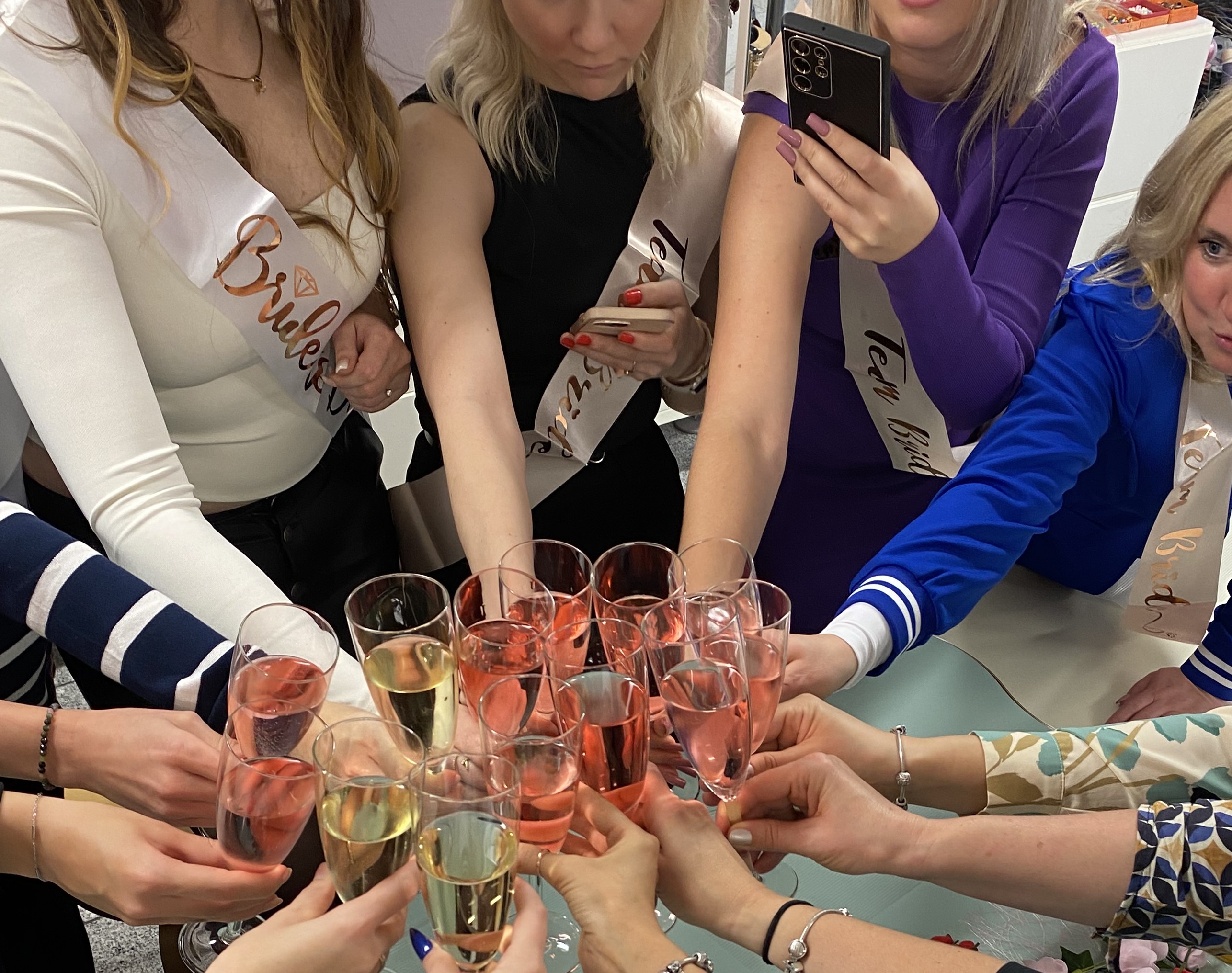 Women toasting with champagne at party.